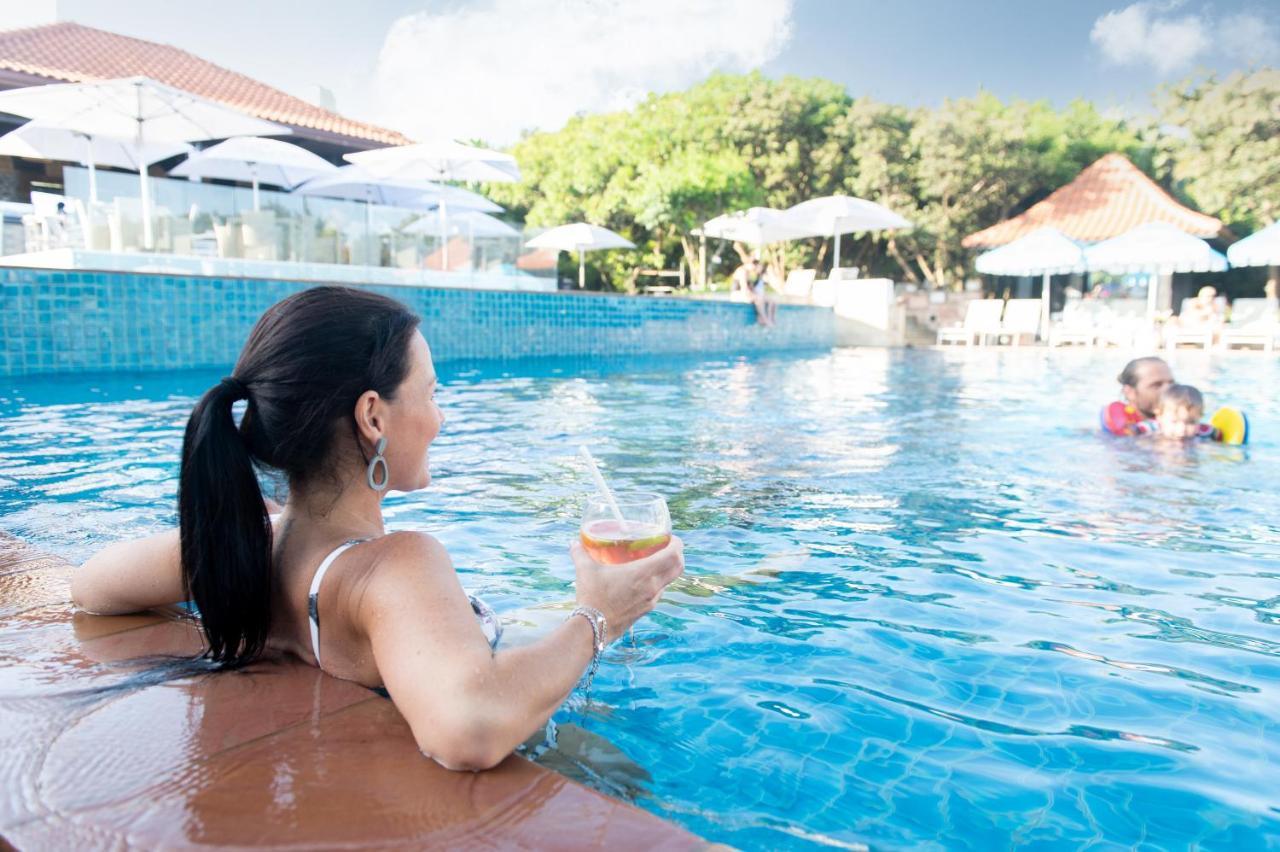 The Capital Zimbali Hotel Ballito Exterior photo A woman relaxing at a pool
