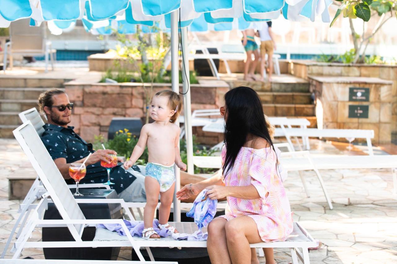 The Capital Zimbali Hotel Ballito Exterior photo Family at the pool