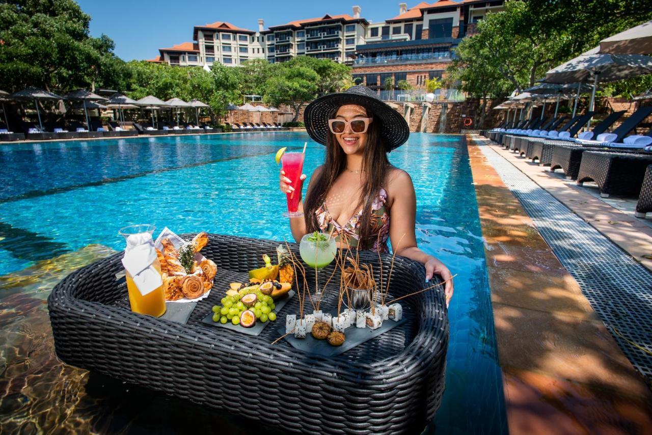 The Capital Zimbali Hotel Ballito Exterior photo Poolside at the hotel