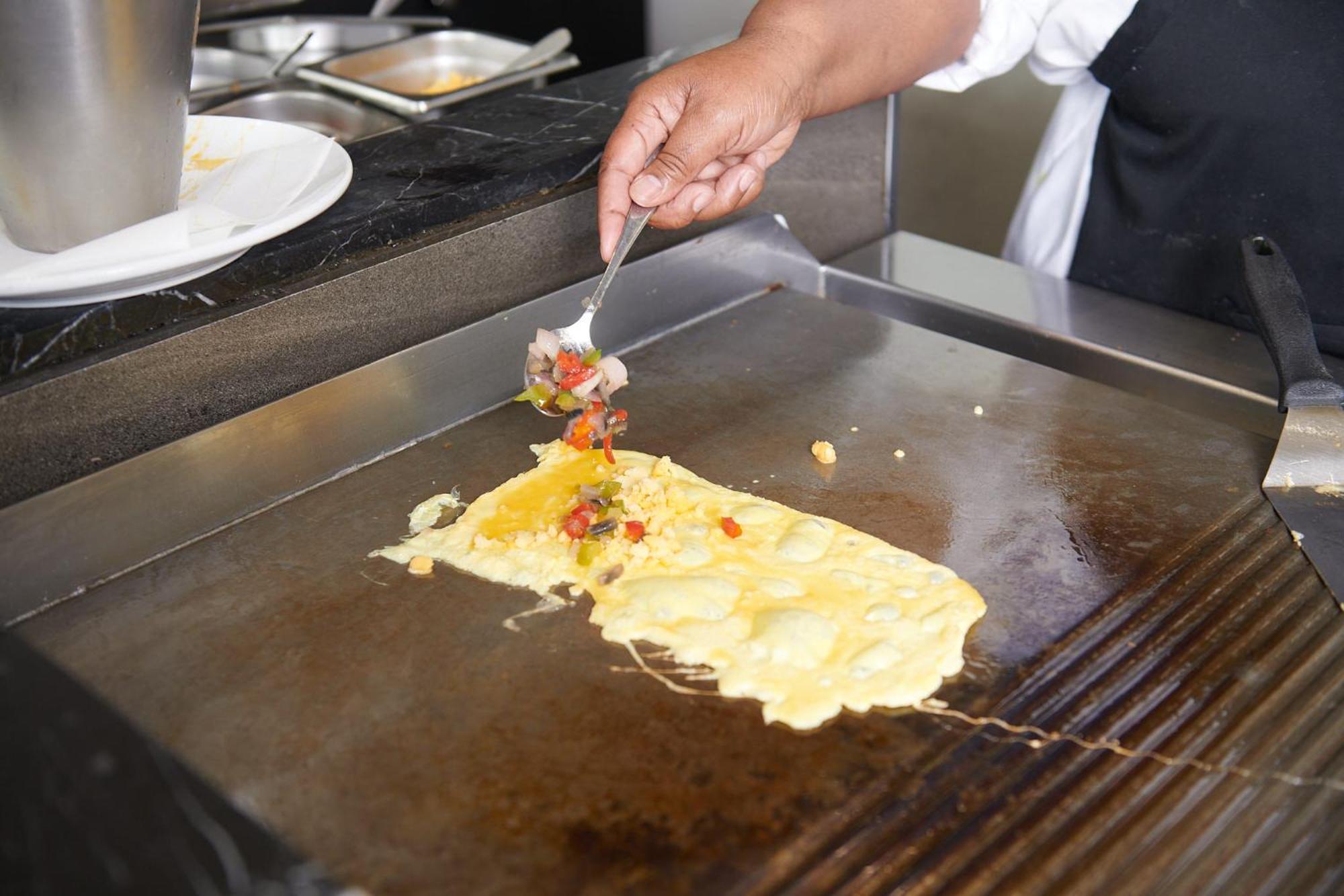 The Capital Zimbali Hotel Ballito Exterior photo Preparation of an omelette